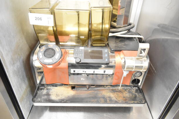 Thermoplan Mastrena stainless steel commercial espresso machine with LCD, hoppers, steam wand. 208V, 1 Phase. Some wear visible.
