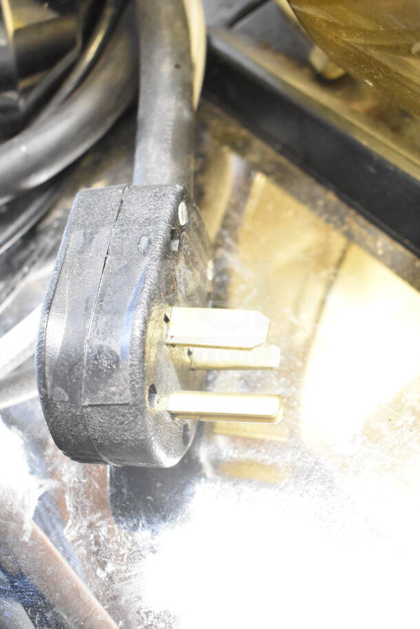 Thermoplan Mastrena espresso machine power plug, 208 volts, shows three prongs.