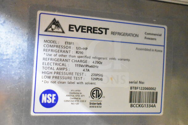 Everest ETBF1 commercial single door undercounter freezer label showing model, refrigerant, and electrical specs.