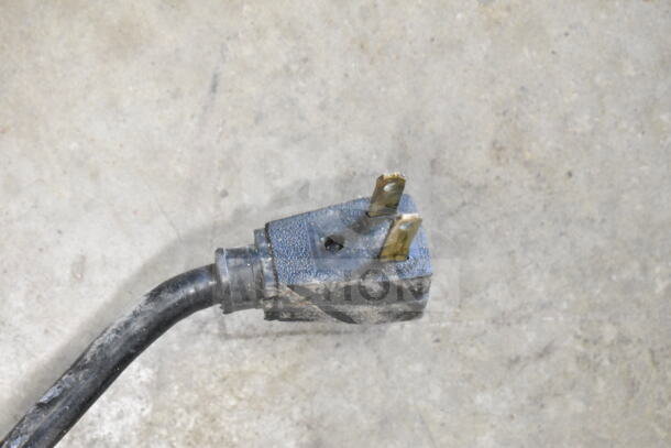 Close-up of a worn power plug for a True T-49 Commercial 2-Door Reach-In Cooler, 115 volts, 1 phase.