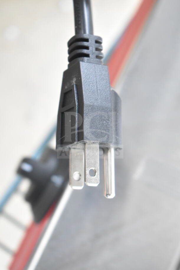 Close-up of the plug of a 2025 Avantco 177HDS175 commercial hot dog steamer, 120 volts, new with minor scratches.