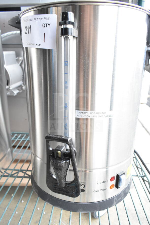Brand new Avantco 65-cup stainless steel coffee urn with minor scratches, 110-120V, visible caution label.