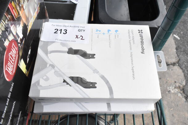 Uppababy Upper Adapters in box, brand new, with auction label indicating "213 QTY X-2".
