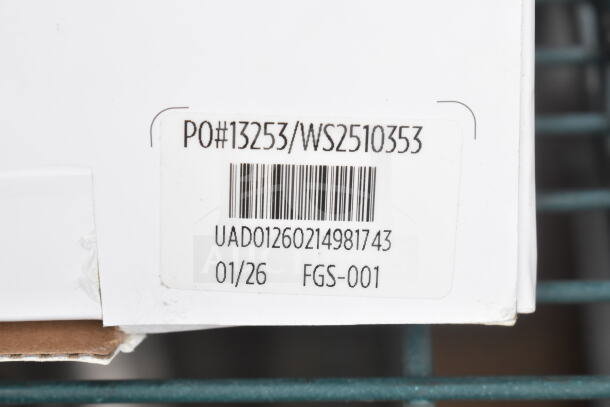 Close-up of a product label showing PO#13253/WS2510353 and barcode UAD01260214981743 for scratch and dent Uppababy adapters.