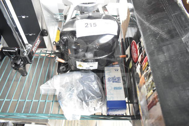 BRAND NEW Cubigel NUT70NR Compressor, 115-127V, 1 Phase, minor scratches, tag reads "215 QTY", accessories included.