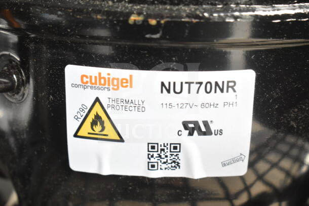 Brand new Cubigel NUT70NR compressor, 115-127V, 1 phase. Label indicates thermal protection and R290 use.
