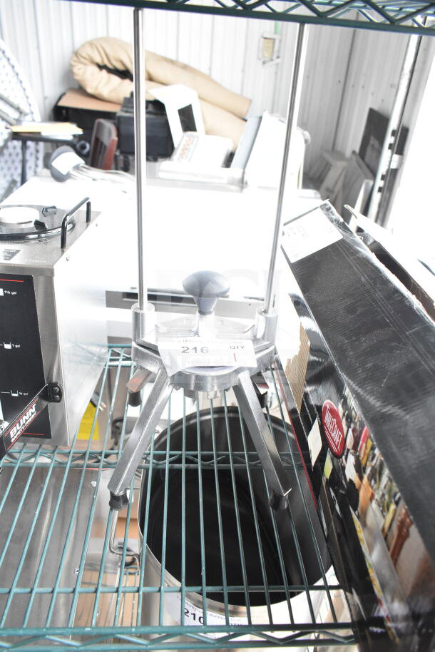BRAND NEW SCRATCH AND DENT Choice 4078WDG Food Prep 8 Section Fruit/Vegetable Wedge Cutter on display shelving.