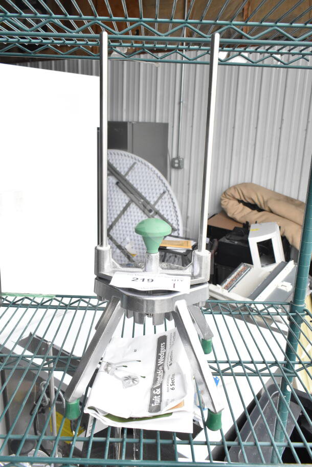Brand new Garde 181WEDGE8 fruit/vegetable cutter, 8-section. Slight scratches/dents, green handle, on metal shelf.