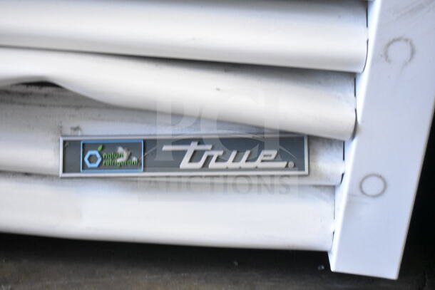 2022 True TSCI-600R-G-PH reach-in cooler, commercial single door, 115V, 1 phase, brand logo visible.