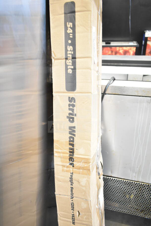 Brand new ServIt 423SW54THA 54" strip warmer in original packaging. Features single toggle control, 120V, 1 phase. Box has minor dents.