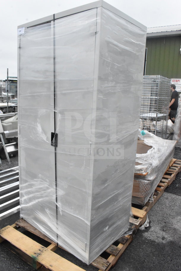 Brand new Hirsh 24"x36"x72" light gray storage cabinet with 4 shelves, assembled. Visible scratches and dents, on pallet.