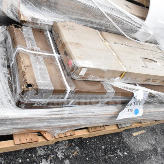 Four new scratch and dent items including a shelf and work table, wrapped on a pallet. Item tag JUN26-121 visible.