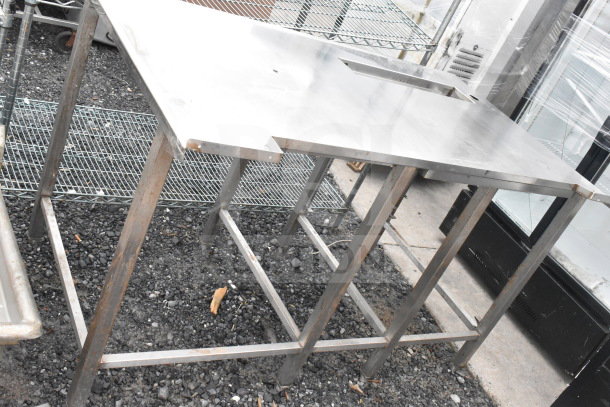 Commercial soda station without drip tray grate, stainless steel construction, open bottom frame, visible wear.