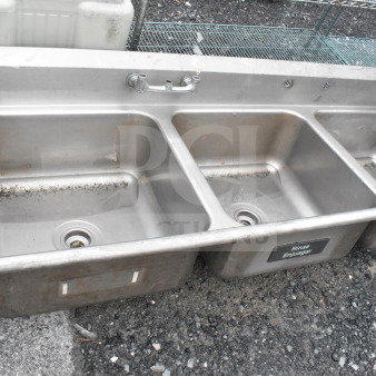 Commercial 3 bay stainless steel sink, missing legs. Features three compartments, faucet, and "Rinse" label. Used condition.