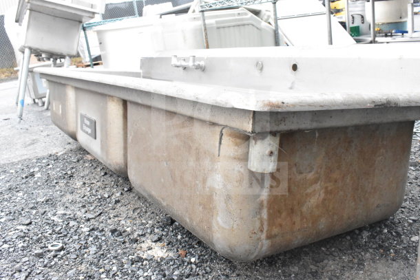 Commercial 3 bay sink without legs, stainless steel, used condition, visible wear. Manufacturer tag partially legible.