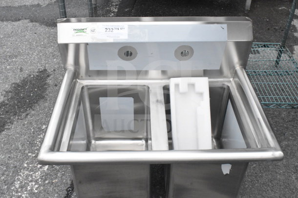 "Regency 600S21014 27-inch two-compartment commercial sink, new, scratch and dent, no legs, NSF certified."