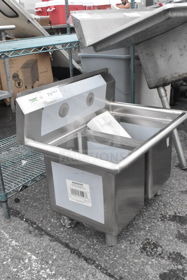 BRAND NEW Regency 600S21014 27" two-compartment commercial sink. No legs, stainless steel, visible barcode and scratches.