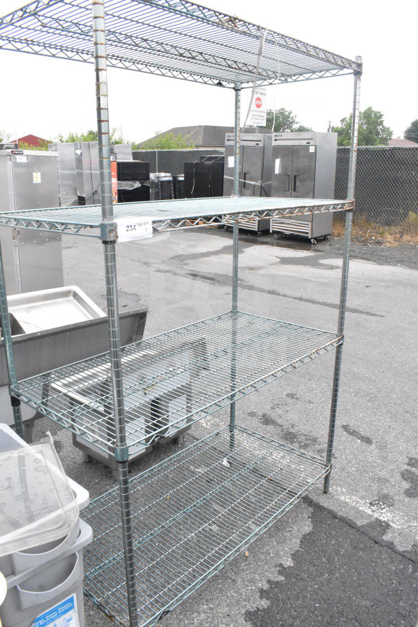 Chrome finish 4-tier wire shelving unit, in used condition. Buyer must dismantle; freight charges apply.