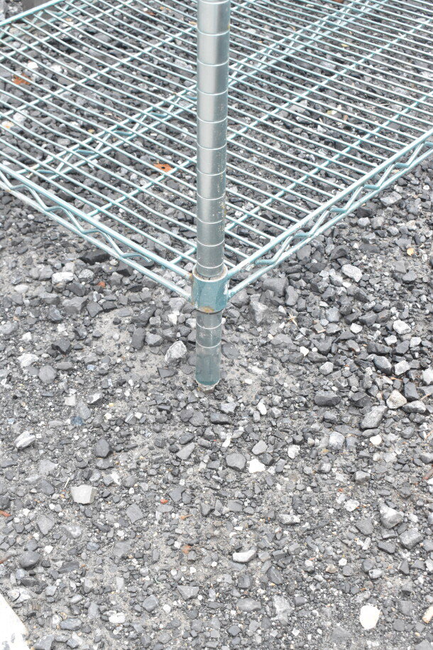 Metro Chrome 4-Tier Wire Shelving Unit with visible wear, buyer to dismantle. Consider freight charges.