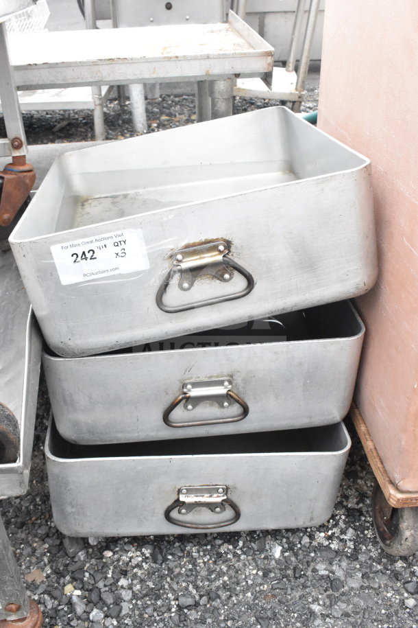 Three stacked metal pans with handles, labeled "242" and "Qty x3," showing signs of use; auction item.
