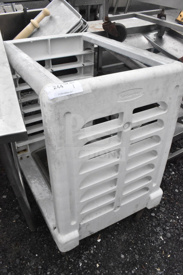 Rubbermaid poly and metal pan transport rack, visible "Rubbermaid" logo, on commercial casters, used condition with label.
