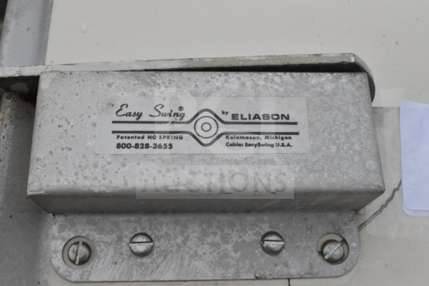 Eliason Easy Swing kitchen door mechanism, labeled "Patented NO SPRING," Kalamazoo, Michigan.
