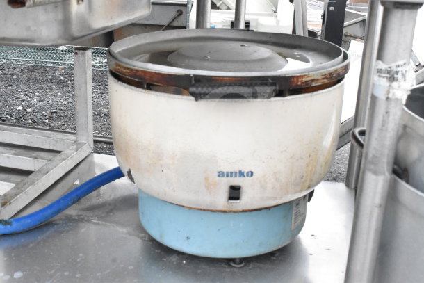Commercial table lot with Amko rice cooker. Includes portable coolers and dunnage rack. Used condition.