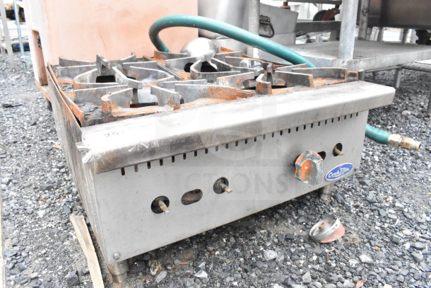 Cook Rite Commercial Countertop Gas 4-Burner Range, visible rust, used condition, brand label on front, outdoor setting.