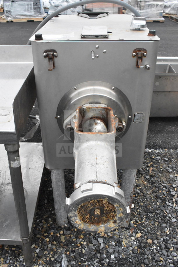 Hobart commercial meat mixer grinder, steel body, visible wear, and rust on the components, industrial use evident.