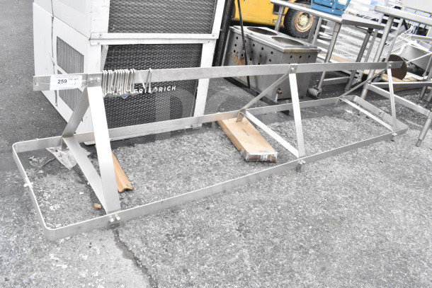 Commercial pot rack with S hooks, stainless steel, good condition, for kitchen storage and organization.