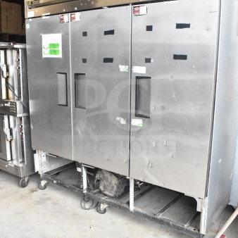 True T-72 3 Door Reach-In Cooler, 115 volts, 1 phase. Stainless steel, commercial use, some exterior wear visible.