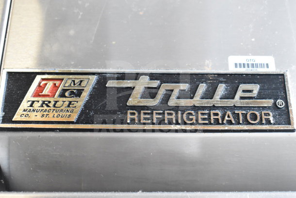 True T-72 Commercial 3 Door Reach In Cooler with branding label, 115 volts, 1 phase, excellent condition.
