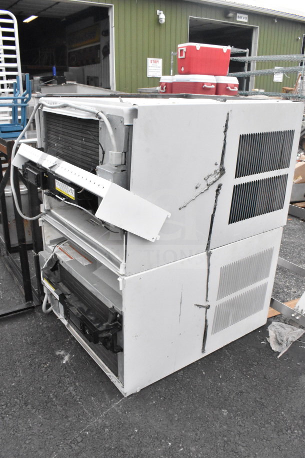 Two Friedrich KCL24A30B-A 23,000 BTU smart air conditioners, visible marks on white units, auction item.