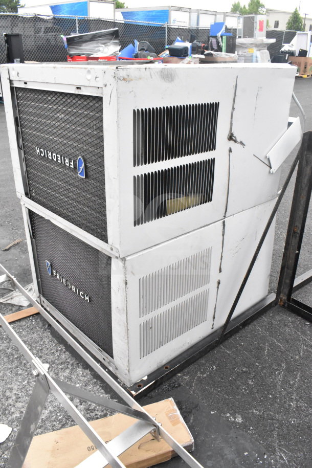 Friedrich KCL24A30B-A 23,000 BTU smart window air conditioners, visible wear, dual units.