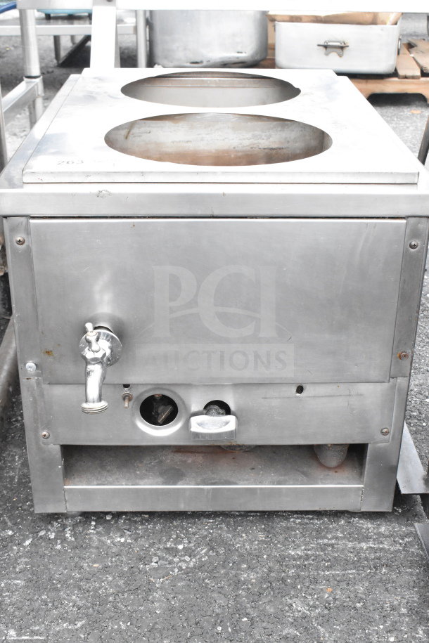 Stainless steel commercial unit with two holes, faucet, and controls, used condition.