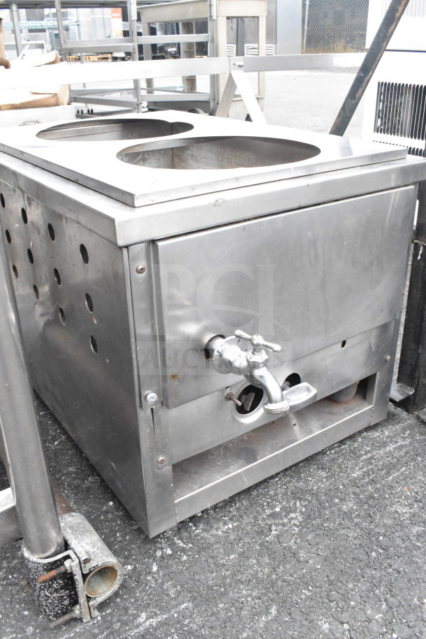 Stainless steel commercial unit, two circular holes, external faucet, perforated sides, used condition.
