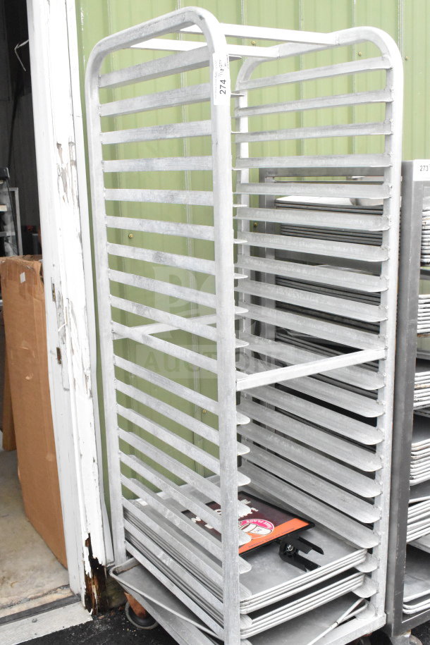 Commercial pan transport rack with 10 baking pans, on commercial casters, sturdy metal construction, good condition.