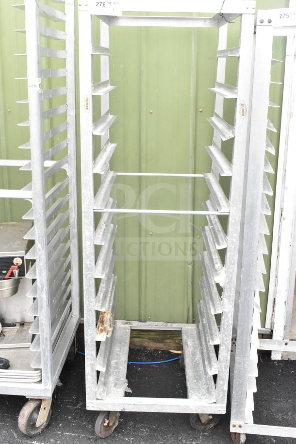 Commercial pan transport rack with multiple shelves, metal construction, on sturdy commercial casters, in used condition.