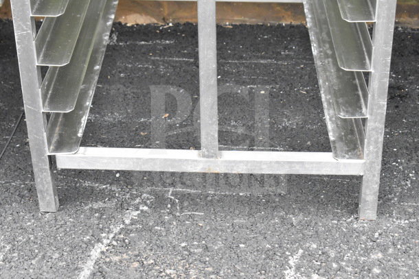 Commercial Pan Transport Rack in metal, sturdy construction, with multiple pan slots, minimal wear. Ideal for kitchens.