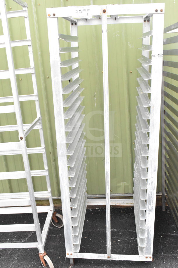 Commercial pan transport rack with multiple shelves, on sturdy casters, in used condition. Marked with item number 279.
