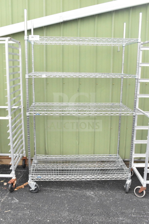 Metro 5-tier chrome wire shelving unit on wheels, commercial grade, needs dismantling by buyer, suitable for freight.