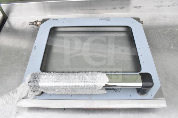 Commercial oven door with protective film, bubble wrap on handle, for table with under shelf and can opener mount.