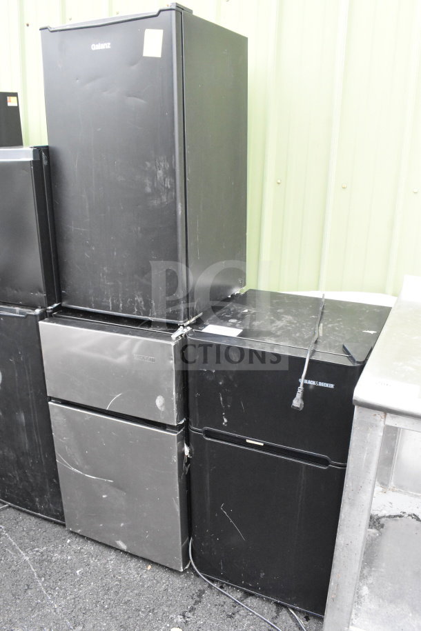 Three mini coolers by Galanz, Black & Decker, Vissani. Used condition, visible surface wear. Powered by 115 volts, 1 phase.