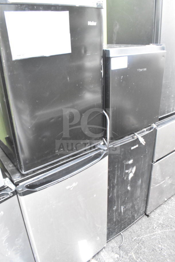 Four mini coolers including Galanz, Whirlpool, Hisense, Haier. Black, various conditions, 115 volts, 1 phase.