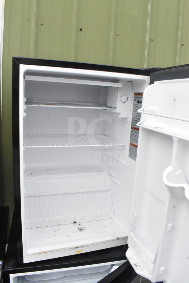 Four mini coolers from Galanz, Whirlpool, Hisense, Haier; 115V, 1 phase. Open interior view, shelving visible. Slight wear.