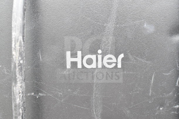 Four mini coolers including Hisense, Arctic King, Haier, 115 volts, 1 phase. Haier logo visible, used condition.
