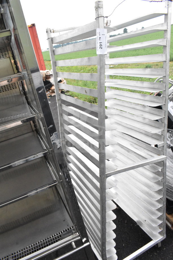 Commercial pan transport rack with multiple slots, metal frame, and casters. Visible ID tag marked with "297" and "1."