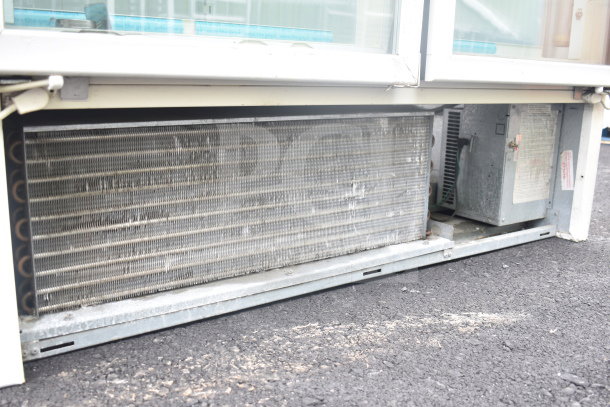 Carrier ULG50BCP-5 2 Door Commercial Reach-In Freezer Merchandiser, shown with condenser detail, used, 115/208-230V, 1 Phase.