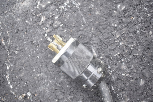 Power plug for Carrier ULG50BCP-5 commercial freezer, visible wear, 115/208-230 volts, for auction item inspection.