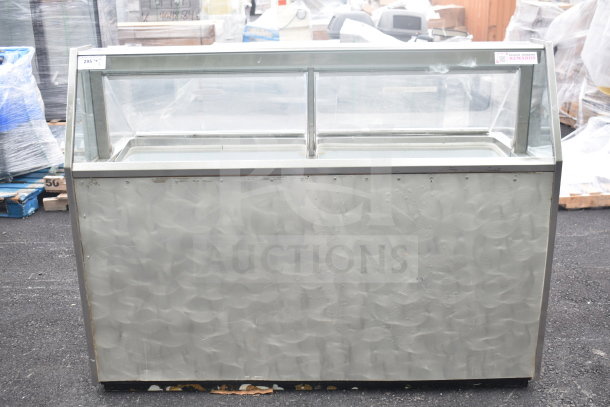 Carrier BRT68P commercial chest freezer with 3 ice cream tub collars, 115 volts, 1 phase; visible wear.